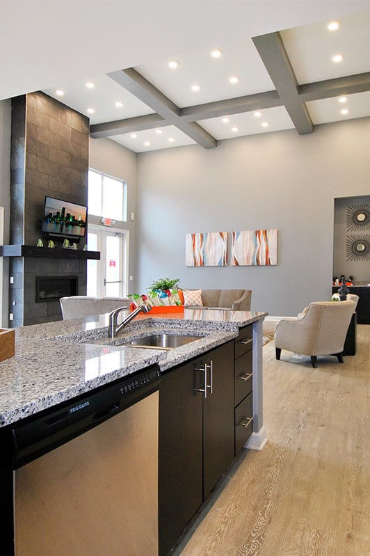 a large kitchen with granite counter tops and stainless steel appliances