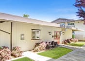Thumbnail 3 of 17 - a house with a sidewalk and grass in front of it