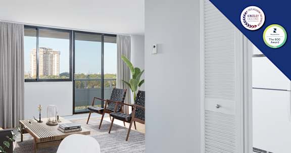 A modern living room with a view of the city.
