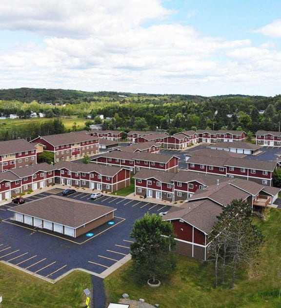 an aerial view of a building complex with a road