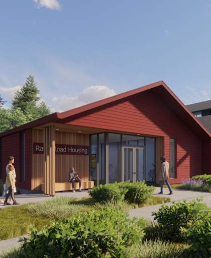 A red building with the words "Rail Housing" on it.