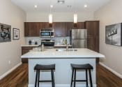 Thumbnail 4 of 50 - Kitchen with granite countertops at The Canyons at Linda Vista Trail, Oro Valley, AZ, 85704