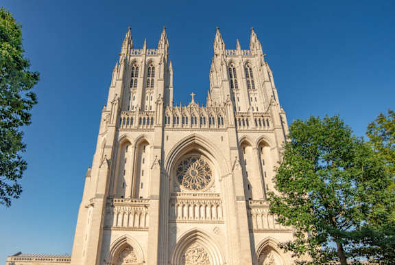 people standing in front of the cathedral of notre dame