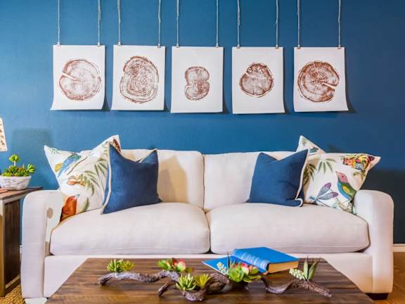 a living room with blue walls and a white couch