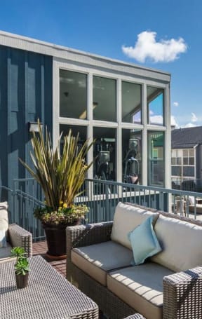 a patio with furniture and a pool in front of a house  at Skyline Heights LLC, Daly City
