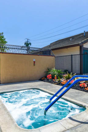 take a dip in the hot tub at villas at houston levee west apartments in