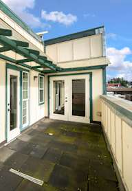 A hallway with mailboxes numbered from 201 to 214.