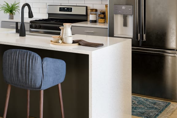 an open concept kitchen and living room with a large white island with blue bar stools
