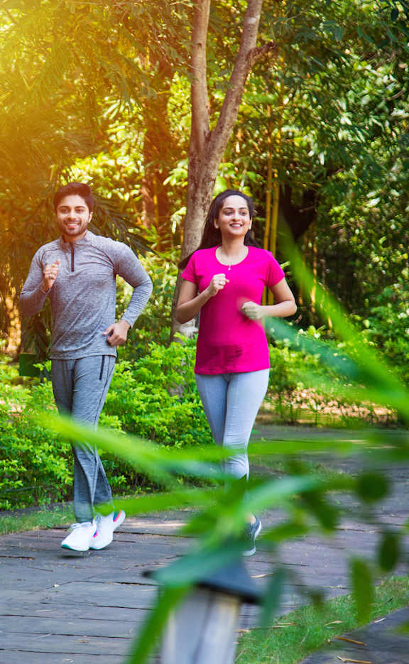 a couple jogging in a park