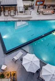 Lenox Cooper Apartments in Arlington, Texas Pool with Lounge Chairs