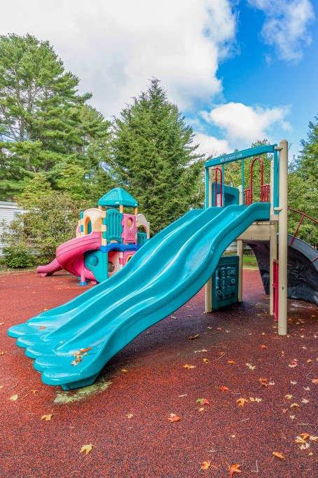 a playground with a slide and other toys in a park at Haven East, Maine, 04011