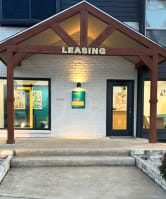 the front of a leasing office in a building