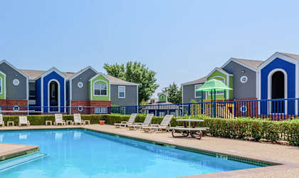 view of pool and building exterior