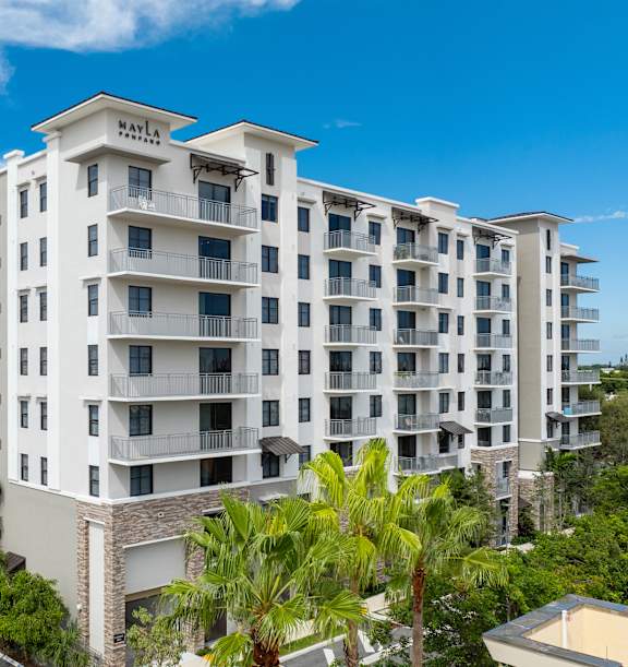 A white hotel building with the word "MAYA" on the top.