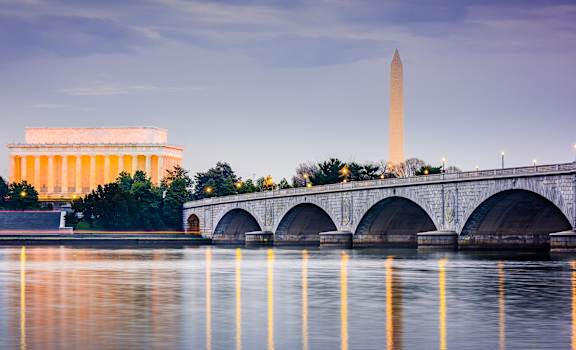 The Washington Monument and the Lincoln Memorial are visible across the reflective water.