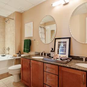 A bathroom with a toilet, sink, and shower.