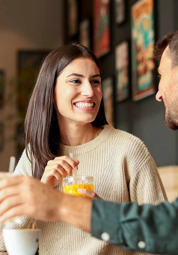 A man and a woman are sitting at a table, enjoying a drink together.at Montage, Tigard, 97223