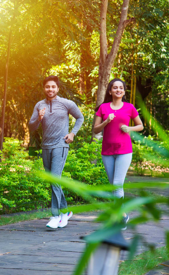 a couple jogging in a park