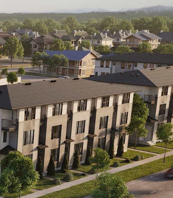 A modern apartment building with a grassy front yard.