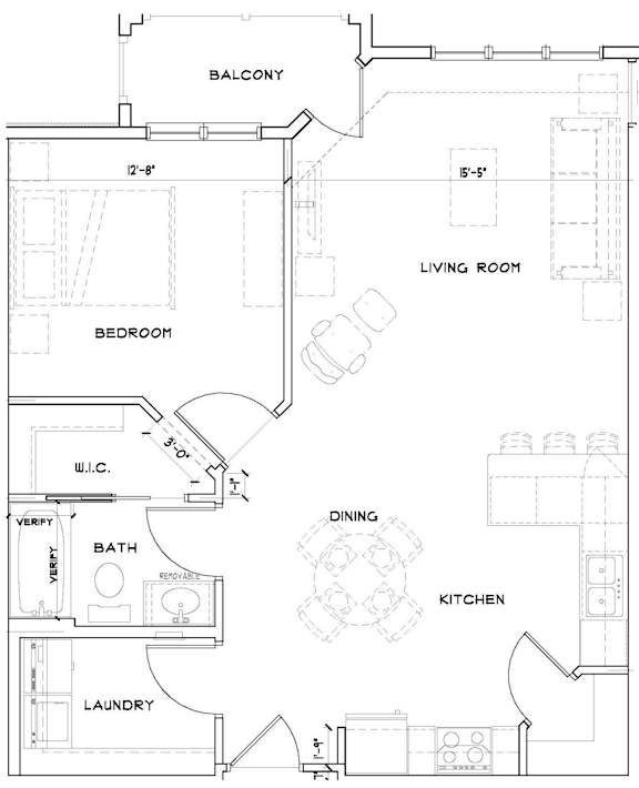 A floor plan of an apartment with a living room, bedroom, kitchen, dining area, and laundry room.