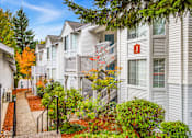 Thumbnail 4 of 26 - A row of houses with a pathway between them.