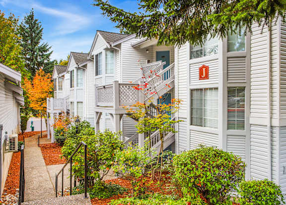 A row of houses with a pathway between them.