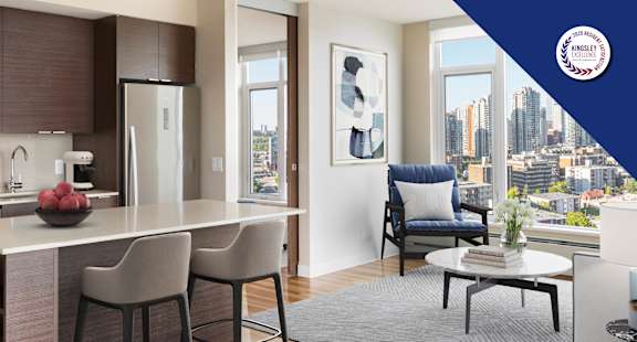 A modern kitchen with a view of the city.