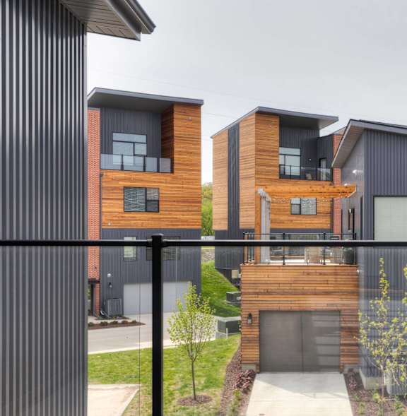 modern home with a balcony and a glass railing at 5Fifty5, Des Moines, 50309
