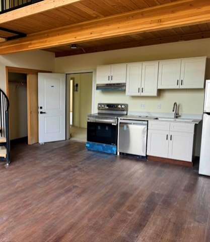 Kitchen with a spiral staircase at Atomic Orchard Experiment, Portland