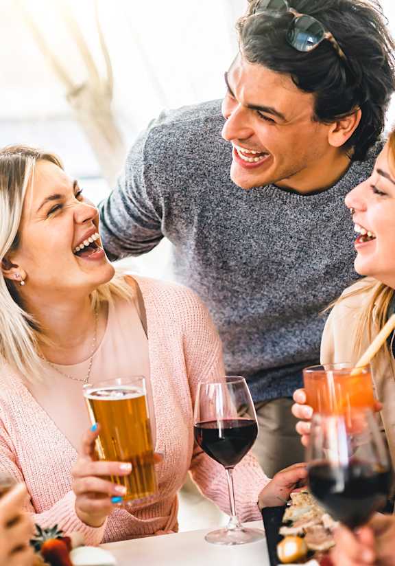 A group of friends enjoying a wine tasting together.