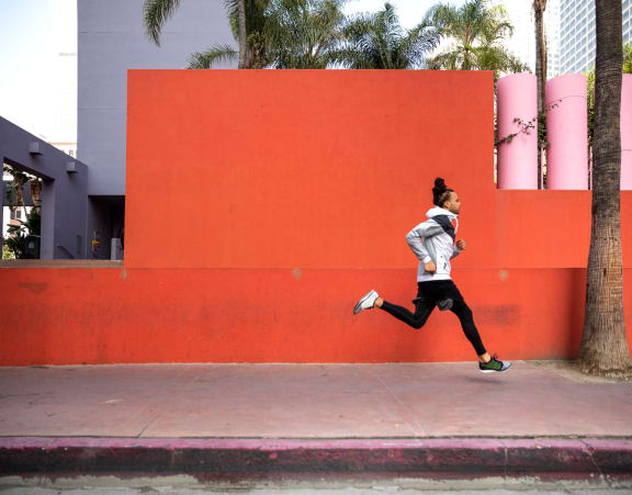 fit man running in downtown los angeles
