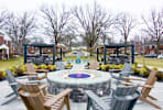 a firepit and chairs on a patio with homes in the background at Alister Morristown, Morristown, NJ, 07960
