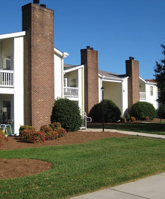 A basketball court with a blue hoop and white lines. at Fox Hollow Apartment Homes, High Point, NC, 27265
