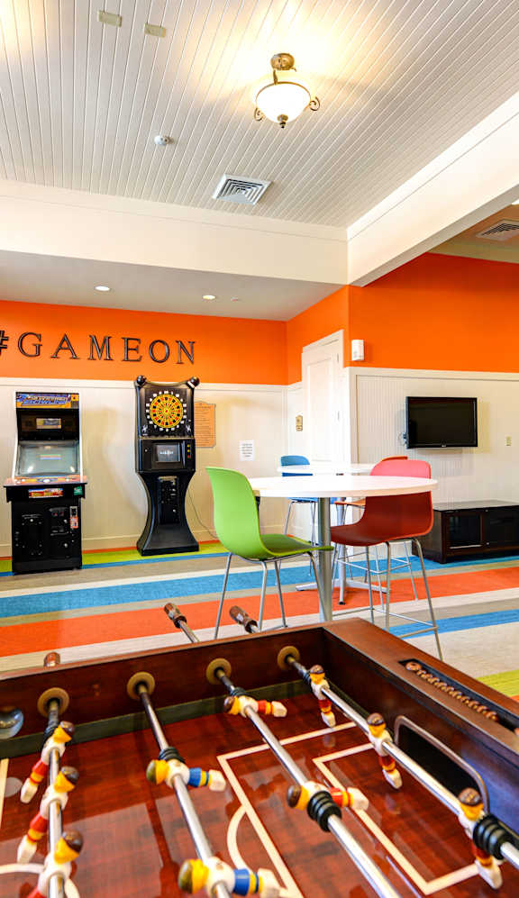a recreation room with a pool table and a game room