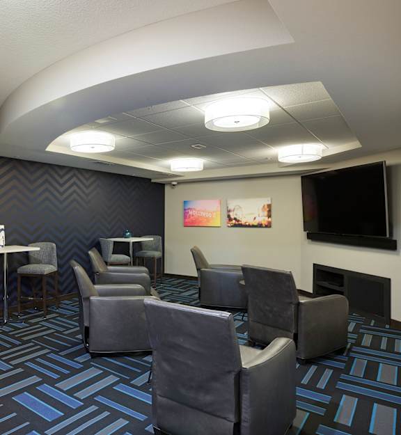 a theater room with chairs and a tv at Gabella at Parkside, Minnesota