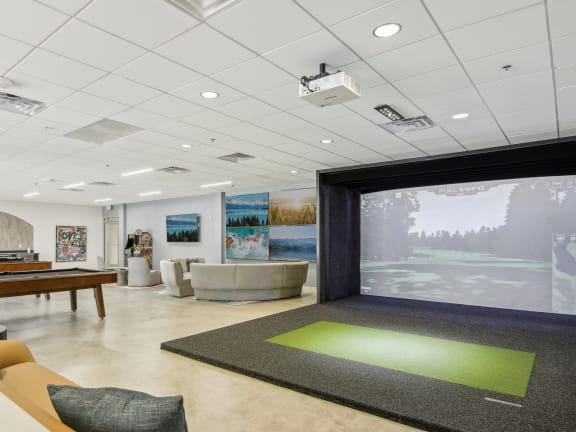 a game room with a pool table and a disco ball ceiling