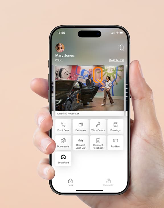 A hand holding a smartphone with a photo editing app open.