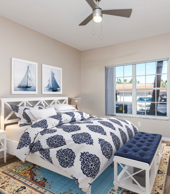 a bedroom with a bed and a ceiling fan at Bay Breeze Villas, Florida, 33908