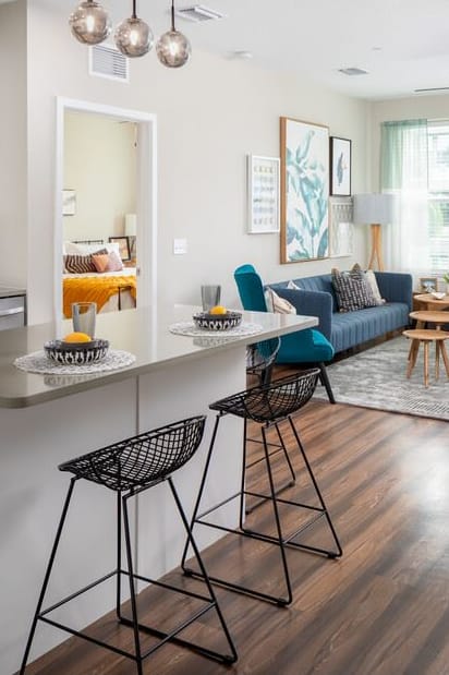 a bedroom with a bed and a ceiling fan at 19 South Apartments in Kissimmee, FL