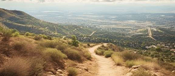 a dirt road on a hill with a view of the valley at River Oaks, Oceanside, CA