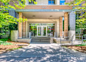 Thumbnail 6 of 33 - The front of a building with the number 202 on it.