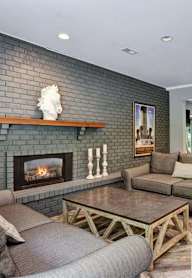 a living room with gray walls and a fireplace