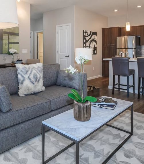 a living room filled with furniture and a large window at The Canyons at Linda Vista Trail, Oro Valley, Arizona