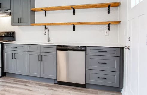 a kitchen with gray cabinets and white walls  at The Oasis on Cascade, Atlanta, 30310