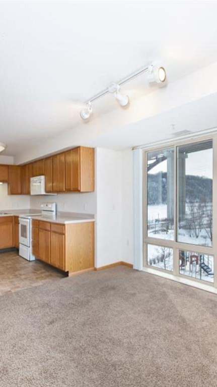 Kitchen with Wooden Cabinets at Joseph's Pointe at Upper Landing Apartments, Minnesota