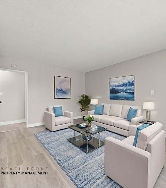 A well-lit, modern kitchen and living room with a dining area.