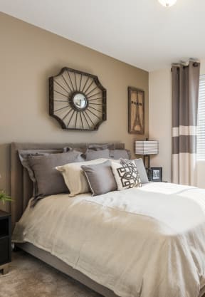 a bedroom with a bed and two windows at Estate at Woodmen Ridge, Colorado, 80923