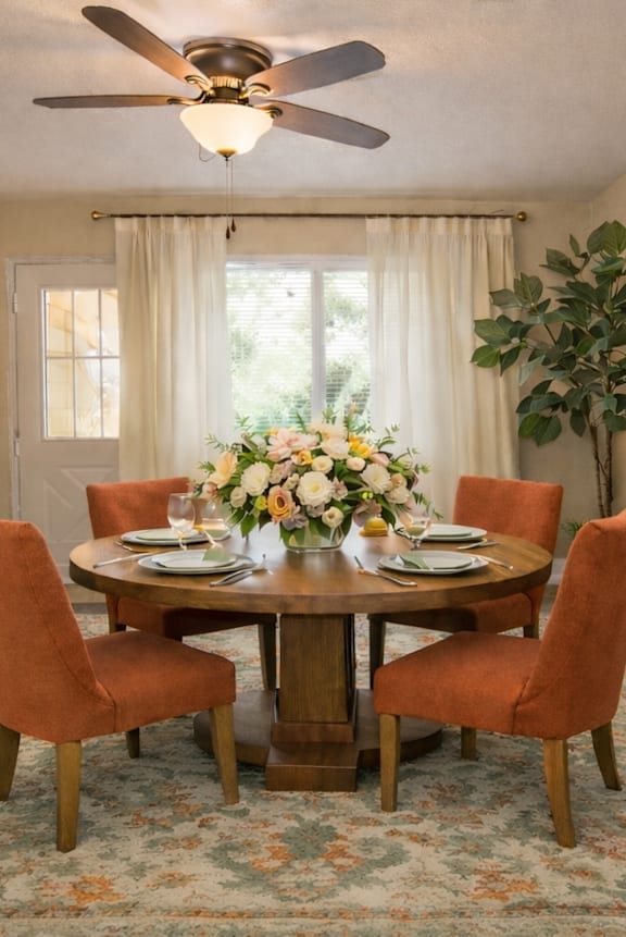 a living room with white couches and a coffee table  at Castle Vista Senior Duplex Community, Atwater, CA