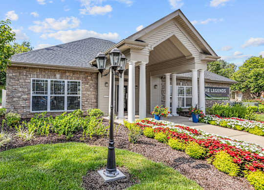 Exterior of the clubhouse with lush landscaping