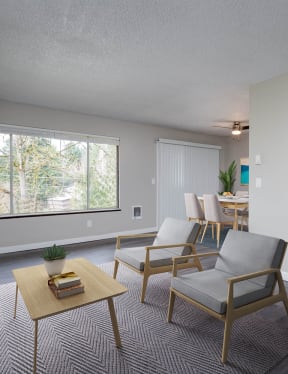 a living room with a couch and chairs and a table